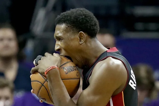 Josh Richardson bites the basketball